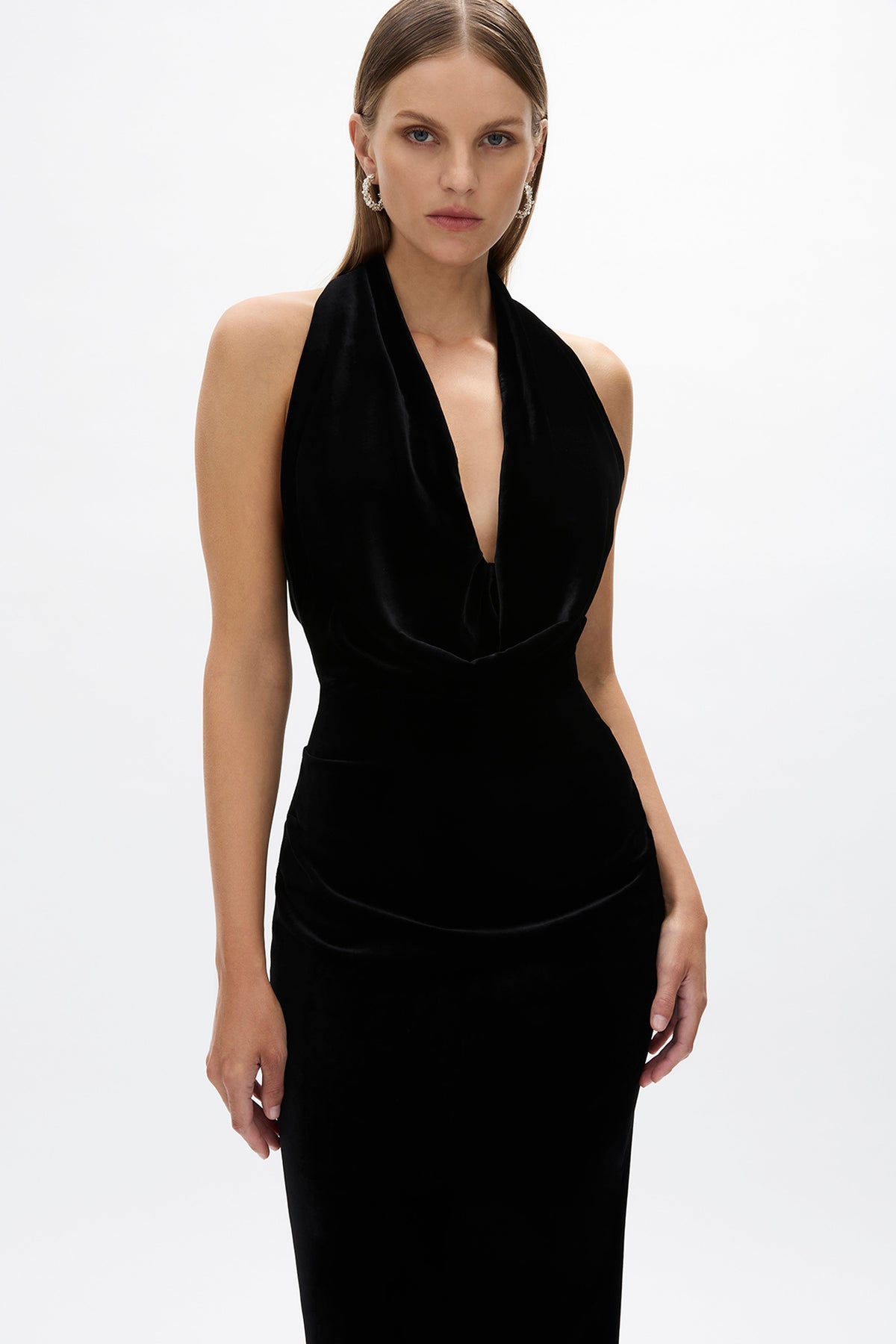 Detail image of model wearing Rachel Gilbert Martin Plunge Gown, black velvet halter gown with deep plunge neckline and internal corset.