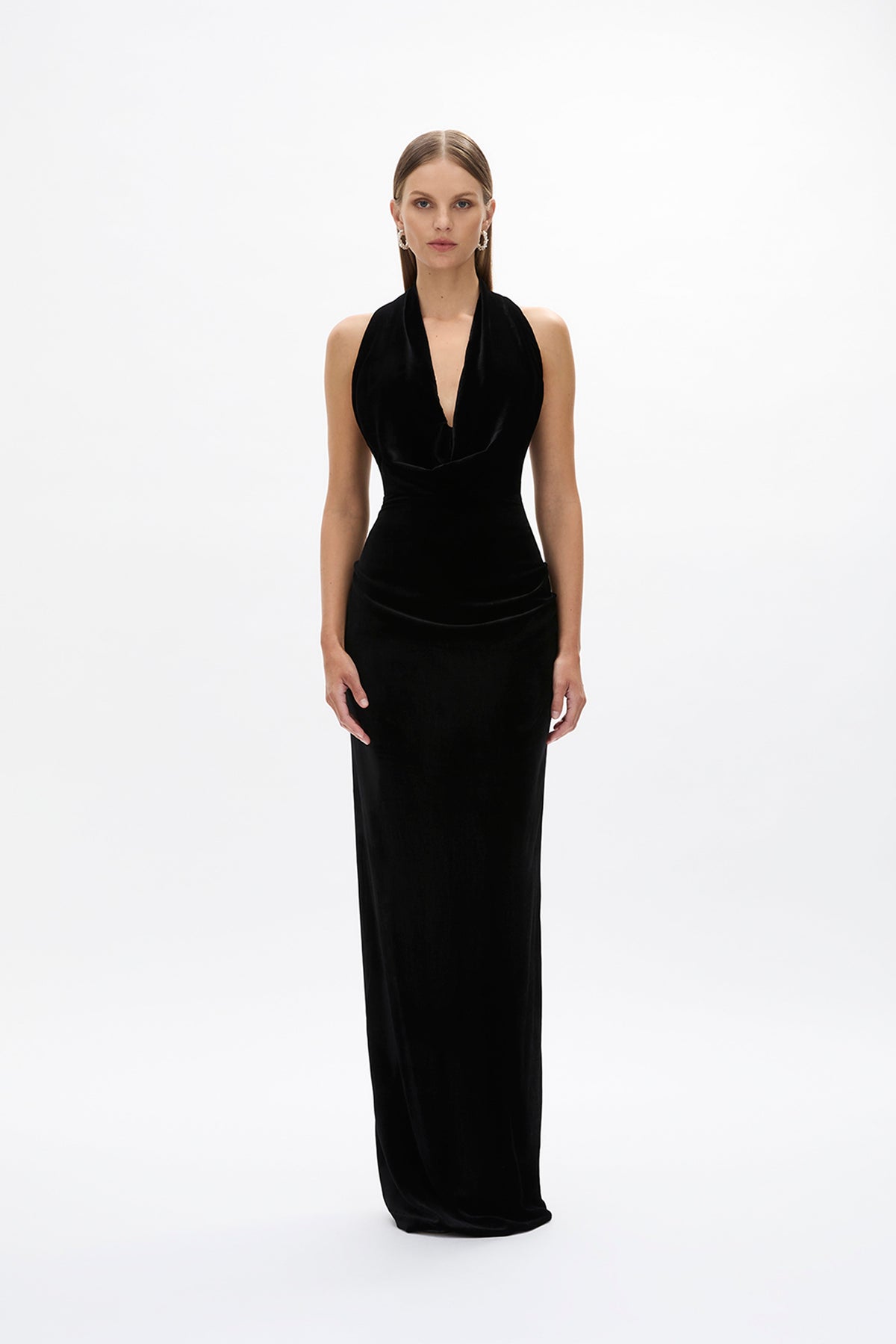 Second front image of model wearing Rachel Gilbert Martin Plunge Gown, black velvet halter gown with deep plunge neckline and internal corset.